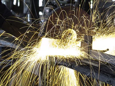 man welding sparks